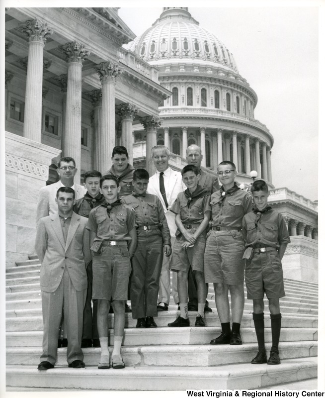 Congressman Arch Moore, Jr. with an unidentified group of Boy Scouts on the steps of the Capitol Building.