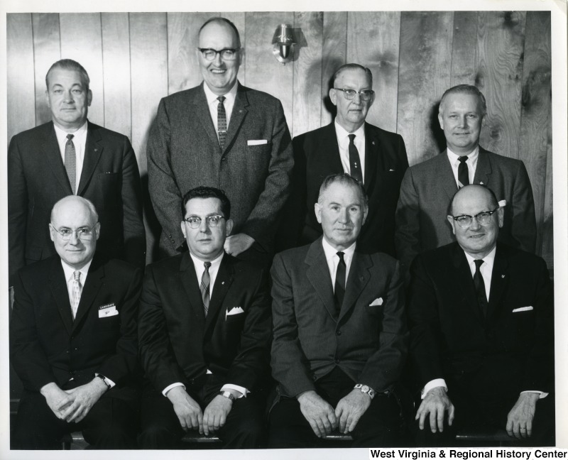 Congressman Arch A. Moore, Jr. (back row, first on the right) standing with an unidentified group of men from Weirton Steel Company.