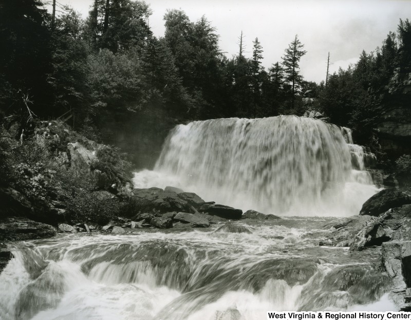 A black and white photograph from the base of Blackwater Falls.