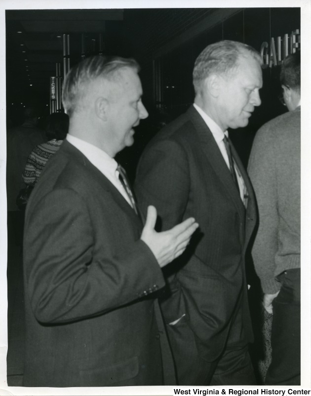 Congressman Arch A. Moore, Jr. walking with and talking to Gerald Ford, who at this time was a Michigan Congressman.