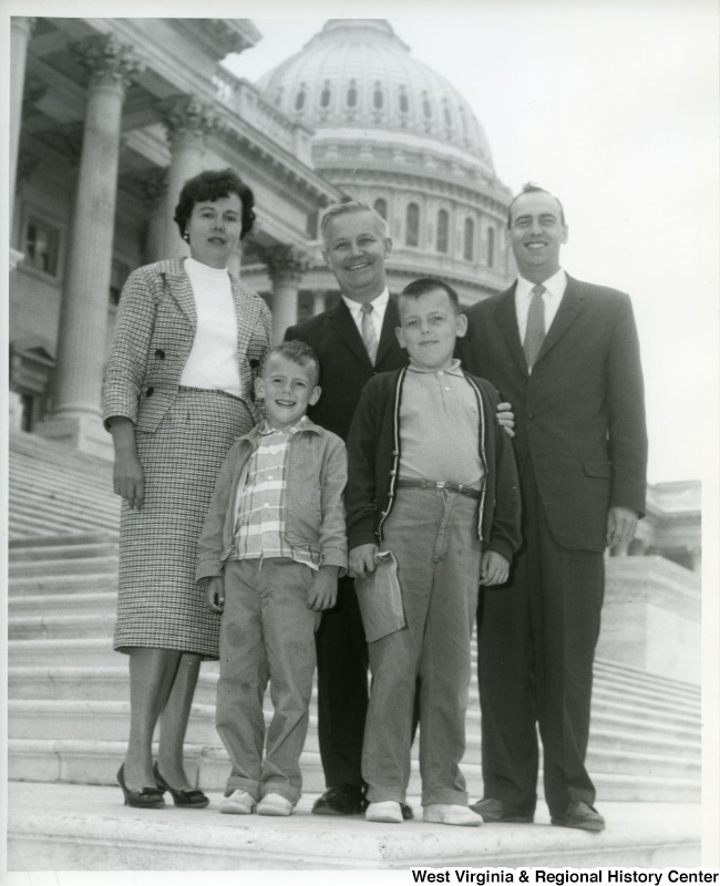 Congressman Arch A. Moore, Jr. (back, center) with an unidentified family on the steps of the Capitol Building.