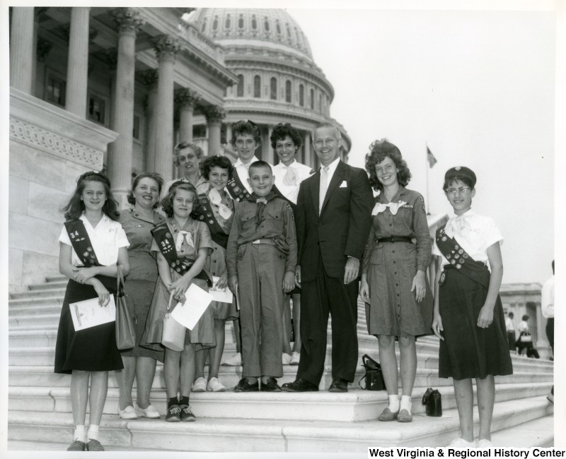 Congressman Arch A. Moore, Jr. was visited by Girl Scout Troop Number 34 of Weirton, W.Va. The Girl Scouts were accompanied by Mrs. Paul Doboski of Weirton, Scout Leader, her son, Paul Doboski, and Mrs. Andrew Jezierski, also of Weirton. Congressman Moore enjoyed the company of these ladies as the guests at luncheon in the United States Capitol. The members of Troop #34 pictured are Jeanette Oliver, Barbara Kelly, Rita Rurak, Patricia Jezierski, Kelli Sue Pyles, Barbara Pyles, and Stephanie Visnic.
