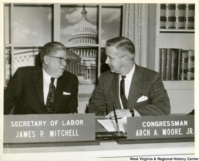 Congressman Arch A. Moore, Jr.  with Labor Secretary James P. Mitchell in the House Recording Studios in Washington. Mitchell will be the Congressman's guest on his weekly radio program which will be released to stations throughout the First Congressional District. Moore is conferring with Mitchell in regard to new legislation recommended by the President to extend unemployment benefits an additional 13 weeks. Moore indicated he would support the bill and urged early enactment by Congress. The Labor Secretary expressed optimism as to an early upturn in business and more jobs to ease the economic slump.