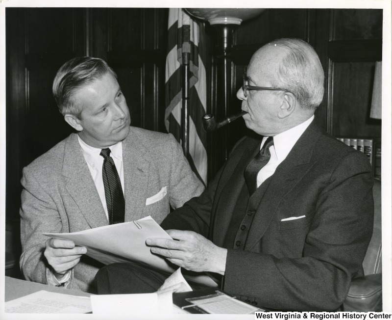 Congressman Arch A. Moore, Jr. having a discussion with Secretary of Commerce Lewis L. Strauss. Strauss was acting secretary for President Eisenhower from November 13, 1958  June 30, 1959.