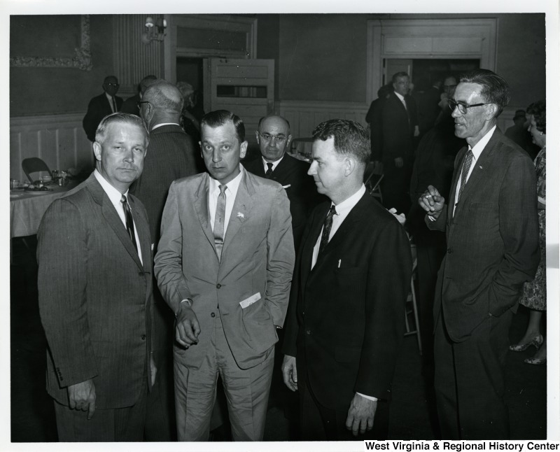 Congressman Arch A. Moore, Jr. with three unidentified men at a party.