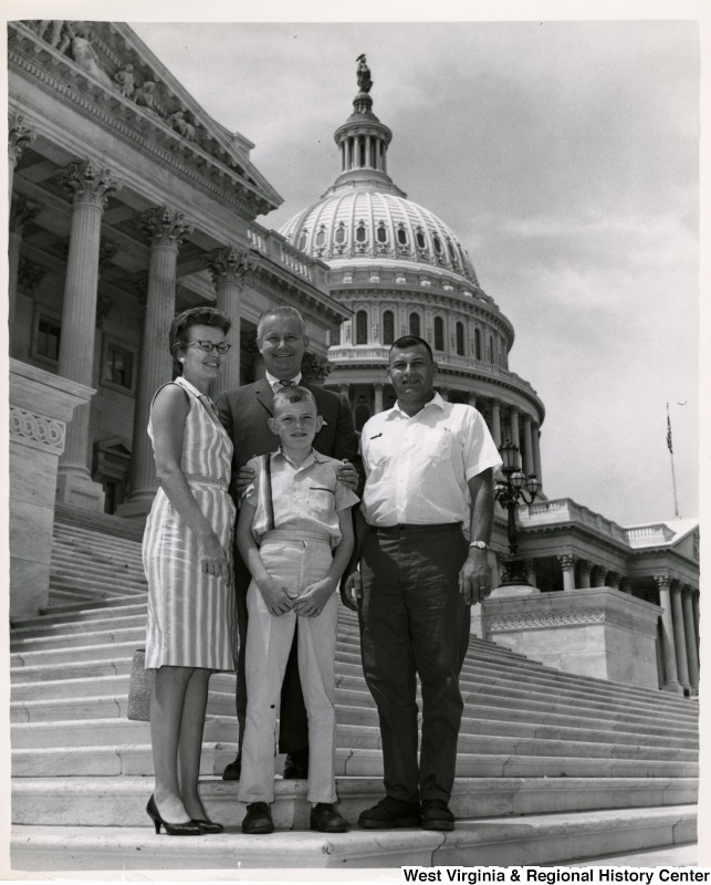 Congressman Arch A. Moore, Jr. with an unidentified family of three.