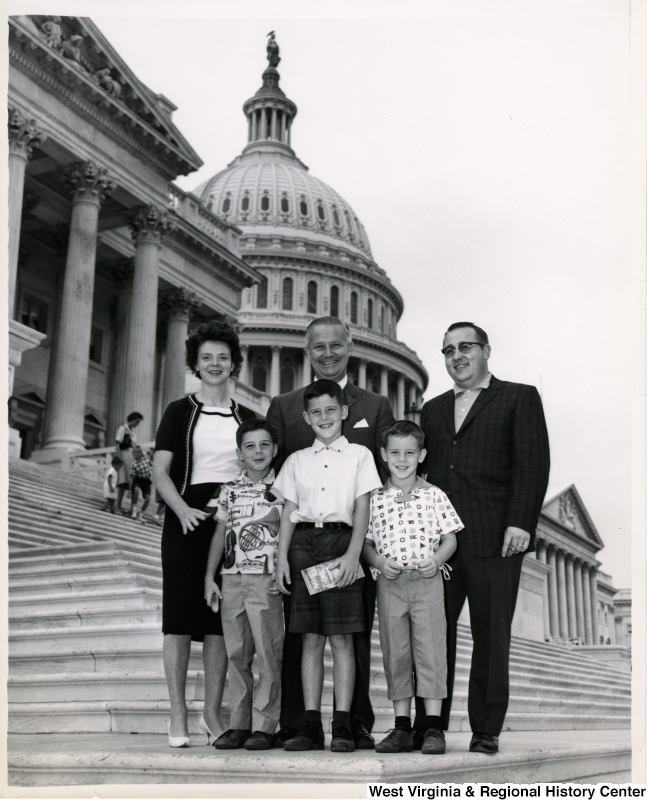 Congressman Arch A. Moore, Jr. (center) standing on the steps of the Capitol Building with the Rodriguez family of Moundsville. From left to right are Helen Marie, Brian, Benny, Bruce, and Benny Rodriguez.