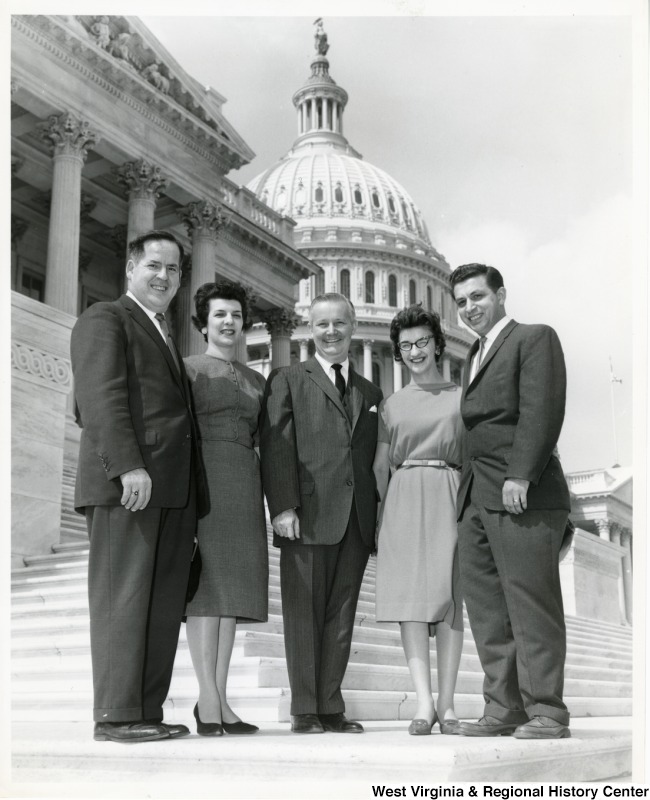 Congressman Arch A. Moore, Jr. with two unidentified men and two women on the steps of the Capitol.