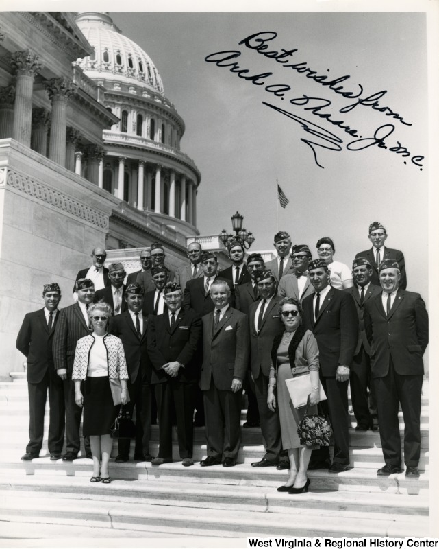 Congressman Arch A. Moore, Jr. standing on the steps of the Capitol with a group of West Virginia Veterans of Foreign Wars.  The photograph is signed "Best wishes from Arch A. Moore, Jr."