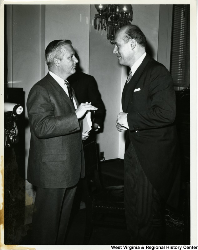 Congressman Arch A. Moore, Jr. talking to an unidentified man.
