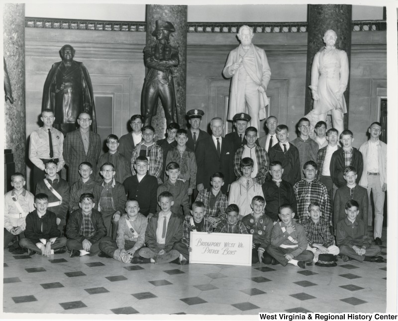 Congressman Arch A. Moore, Jr. (center) with the Bridgeport School Boys Patrol in the Statuary Hall at the Capitol. Moore is flanked by Bridgeport Police Chief John H. Diamond and Thomas D. Kinney. The second statue from the right is that of Francis H. Pierpont, first governor of the restored government of Virginia who was elected to that post in 1861 by delegates at the Wheeling Constitutional Assembly.