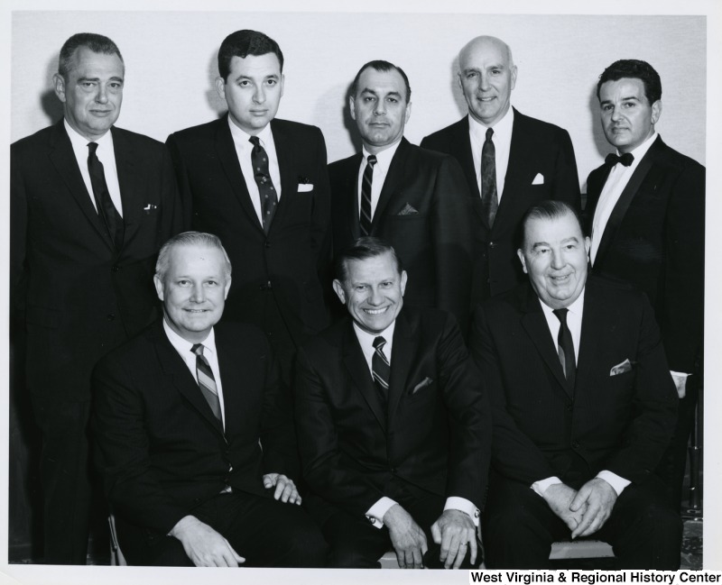 Congressman Arch A. Moore, Jr. (seated, left) with Senator Jennings Randolph (seated, right) with an unidentified group of men at the Italian Sons and Daughters banquet held in Weirton, W. Va.