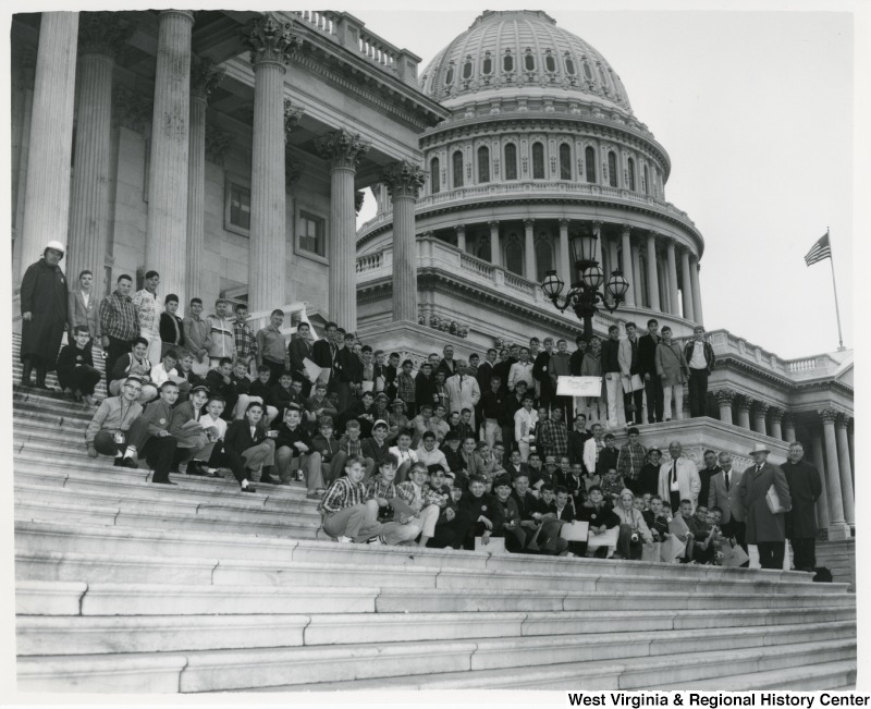 Congressman Arch A. Moore, Jr. standing on the steps of the Capitol with the Marion County School Boy Patrol.