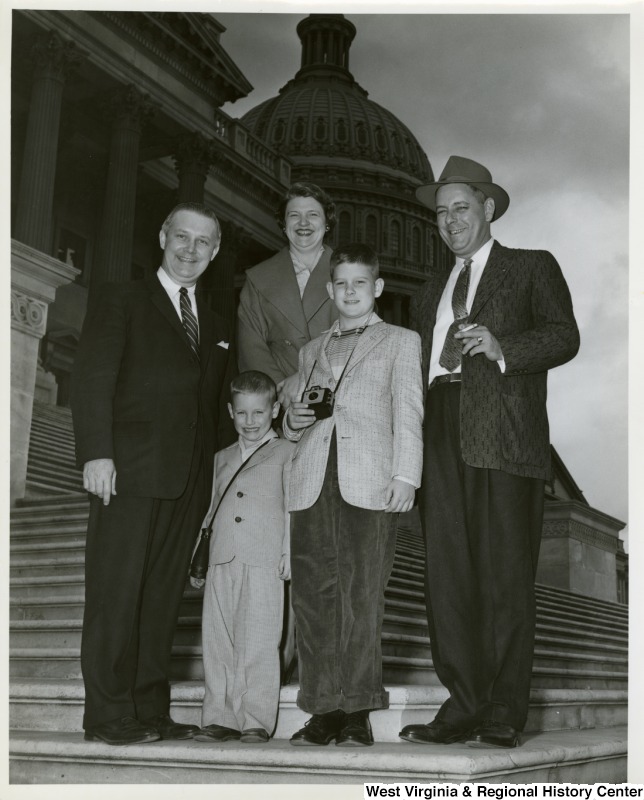 Congressman Arch A. Moore, Jr. on the steps of the Capitol with an unidentified family of four.