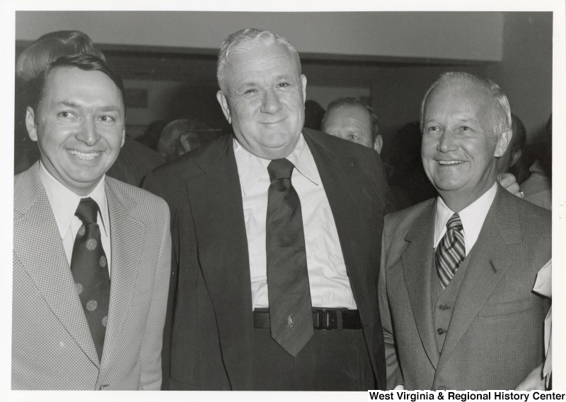 Governor Arch Moore (right) standing with two unidentified men.