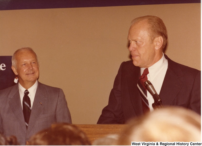 Gerald Ford speaking during Arch Moores campaign rally for governor. Arch is standing to the left of Ford.