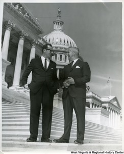 Congressman Arch Moore, Jr. with an unidentified man on the steps of the Capitol Building.