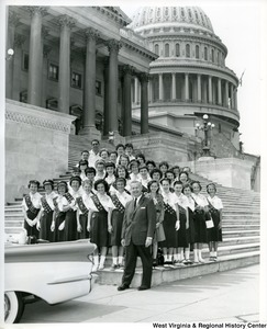 Congressman Arch Moore, Jr (front, center) standing on the steps of the Capitol with 32 Girl Scouts, comprised of Wheeling Troops 3 and 12 and their leader, Mrs. C. W. Prettyman.