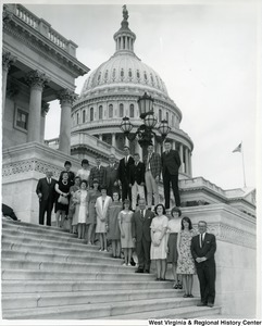 Congressman Arch A. Moore, Jr. (forth from the bottom) posing with a group of unidentified men and women on the steps of the Capitol Building.