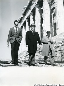 Congressman Arch A. Moore, Jr. (center) walking beside the Parthenon with two unidentified men.