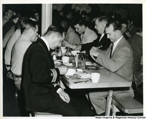 Congressman Arch A. Moore, Jr. (second from the right) eating with some of the  crew of the U.S.S. Franklin D. Roosevelt.