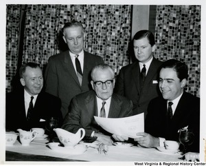 Congressman Arch A. Moore, Jr. with four unidentified men at the West Virigina RSVP dinner.