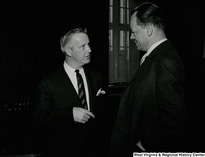 Congressman Arch A. Moore, Jr.  talking to an unidentified man.