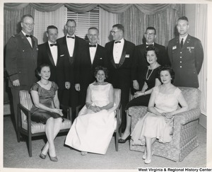 Congressman Arch A. Moore, Jr. and Mrs. Shelly Moore with an unidentified group of men and women.