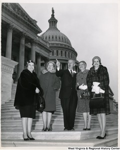 Congressman Arch A. Moore, Jr. standing on the steps of the Capitol with four unidentified women.