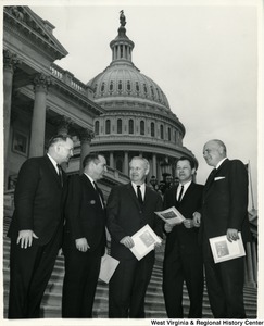 Outlook for legislation that will affect the coal industry is being discussed by Congressman Arch A. Moore, Jr. (center) with Robert E. Lee Hall, vice president of the National Coal Association (right) and G. Don Sullivan associate director of Government Relations. They agreed that residual oil imports and subsidized atomic electric power are the major threats to continued increase in coal output, which that year will exceed 500 million tons. West Virginia's production, which accounts for almost one-third of the nation's total, is running at more than 7 percent above the 1964 output.