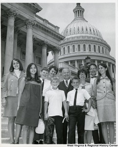 Congressman Arch A. Moore, Jr. standing on the steps of the Capitol with the Lauffert and Mirandy families, who are from Wheeling, W.Va.