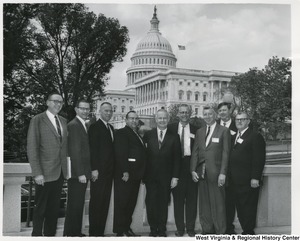 Congressman Arch A. Moore, Jr. standing with postal clerks Albert A. Hagloch, Joseph M. Jurich, Melvin L. Osborne, Henry C. Hoffman, Cecil F. Rommi, C.B. Hibner, James Glover, and John J. Bentz.