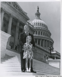 Congressman Arch A. Moore, Jr. on the steps of the Capitol with an unidentified girl.