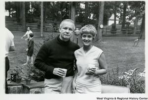 Congressman Arch A. Moore, Jr. standing with an unidentified woman.