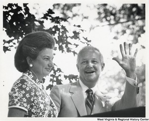 Governor Arch Moore and his wife Shelley. The Governor is waving.