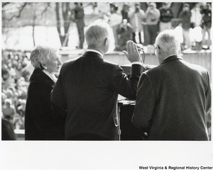 Governor Arch Moore being sworn in as the 30th governor of West Virigina. His wife, Shelley, is to the left of him.