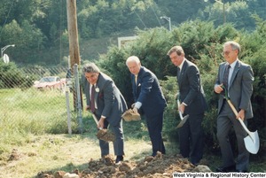 Governor Arch Moore (second from the left) breaking ground with three unidentified men.
