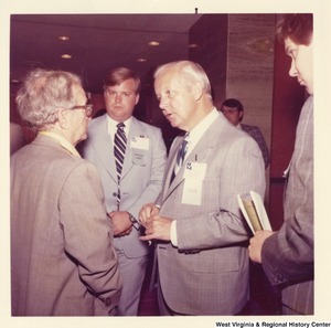 Governor Arch Moore (second from right) speaking to an unidentified man 1975 National Governors Conference in New Orleans. Two other unidentified men are standing with them.