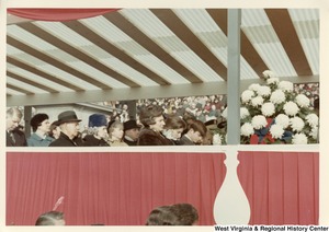 Shelley Moore (seated in the first row) watching her husband, Arch Moore, being sworn into the office of Governor.