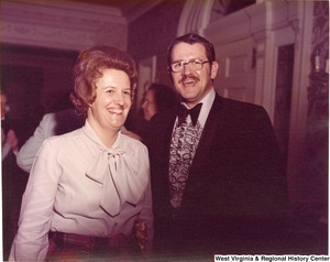 An unidentified man and woman at a reception.