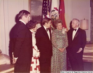 Governor Arch Moore (first on right) speaking to his wife, Shelley, and two men and one woman at a reception.