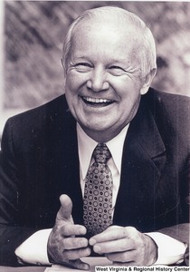 A photo of Governor Arch Moore laughing.