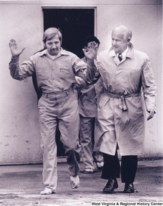 Governor Arch Moore escorting a prisoner from the Moundsville Penitentiary after the prison riot.