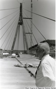 Governor Arch Moore standing on a bridge.