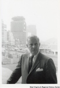 Governor Arch Moore with multiple skyscrapers in the background.