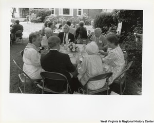 An unidentified group of people eating outside during West Virginias 125th birthday party.