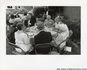 An unidentified group of people eating outside during West Virginias 125th birthday party