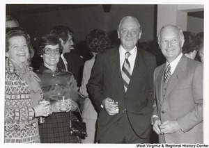 Governor Arch Moore (first on the right) standing with an unidentified man and two unidentified women.