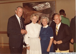 Governor Arch Moore, Jr. (right) standing with his wife Shelley and an unidentified man and woman.