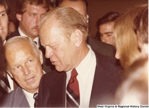 Arch Moore (left) speaking to Gerald Ford (center) during a campaign rally for governor.